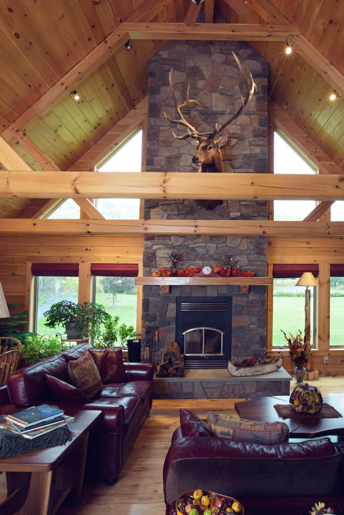 Beaver Mountain Log Homes Holsapple Log Home Stone Fireplace and Timber Trusses