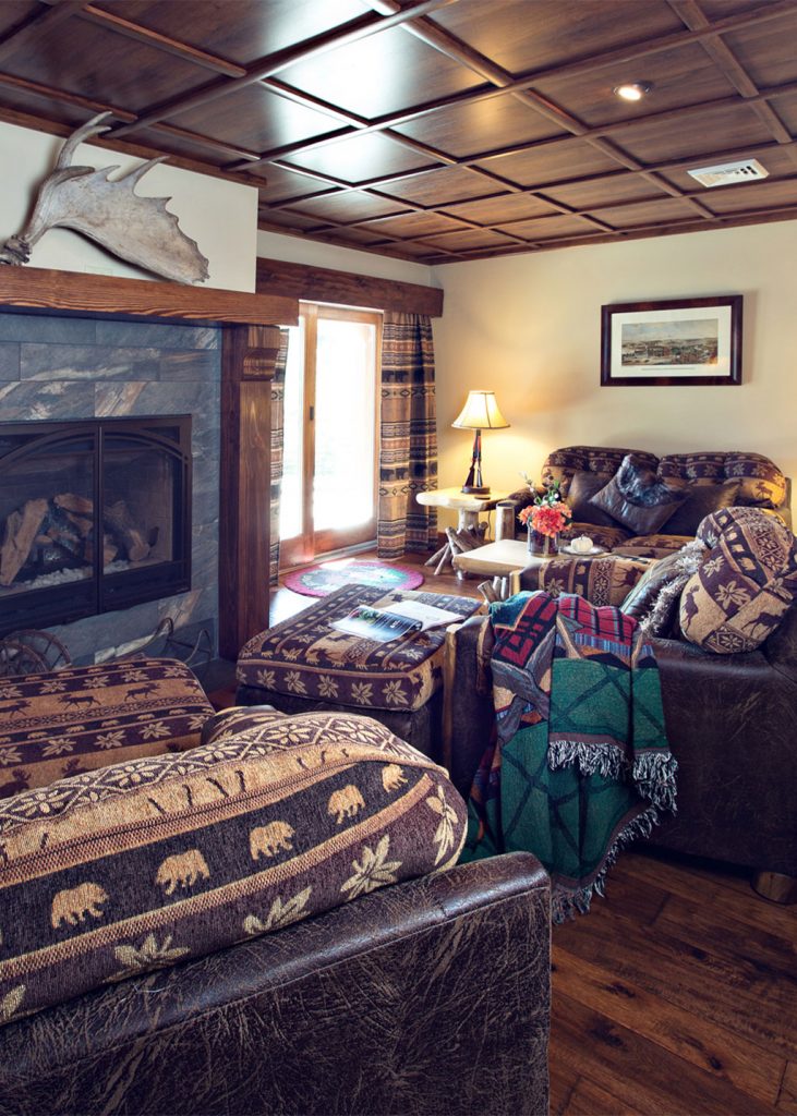 Beaver Mountain Log Homes Owls Club Fireplace and Sitting Room