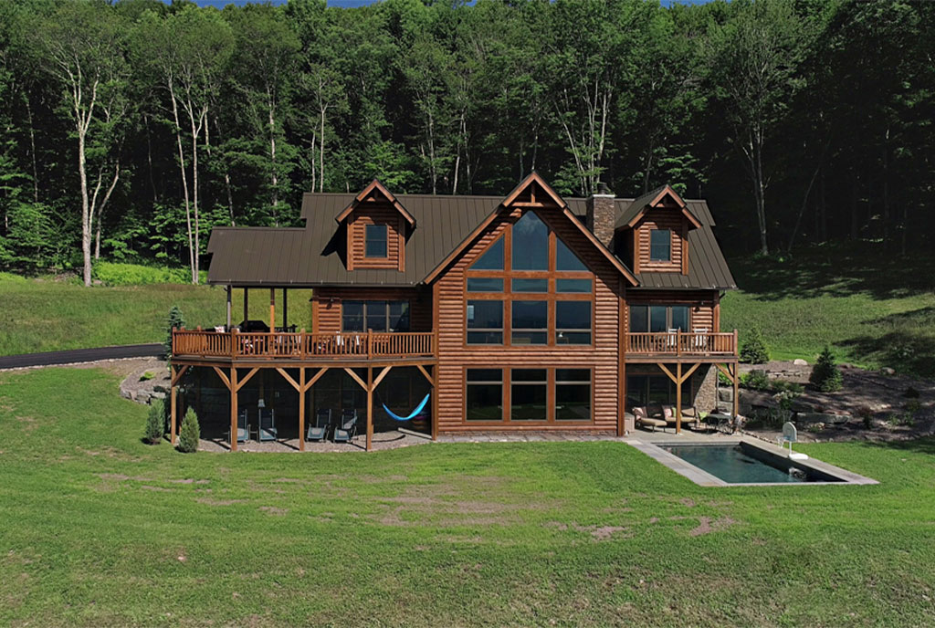 Beaver Mountain Log Homes Valley View Log Home Pool and Exterior Front