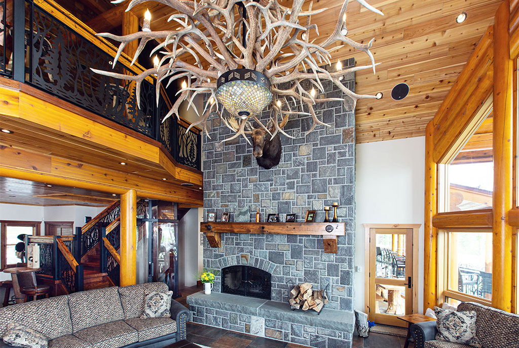 Beaver Mountain Log Homes Kuyahoora Lodge Cedar Hybrid Home Living Space and Stone Fireplace