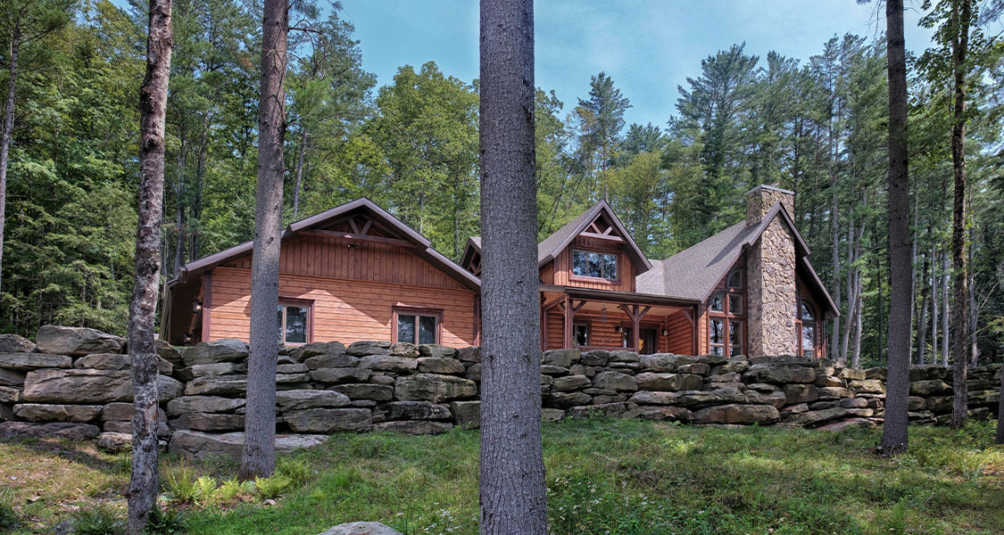 Black Bear Lodge with stone wall